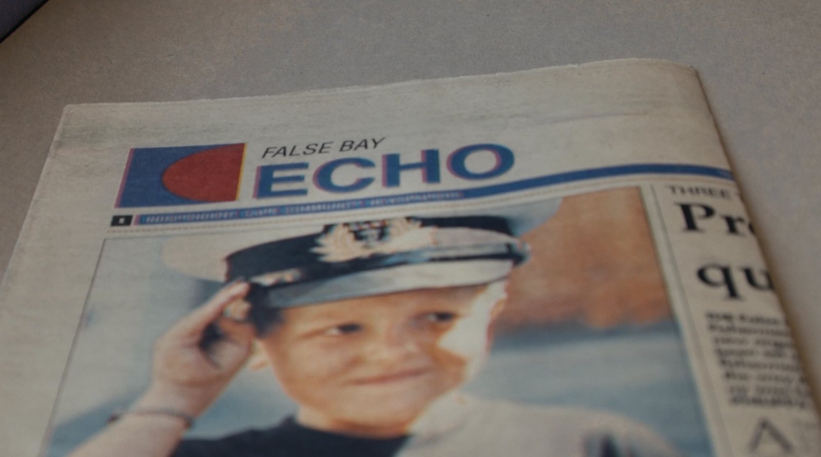 False Bay Echo front page with Chris saluting in a naval cap